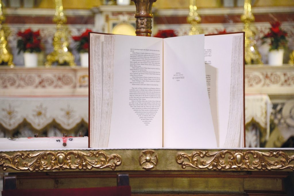 white book page on brown wooden table